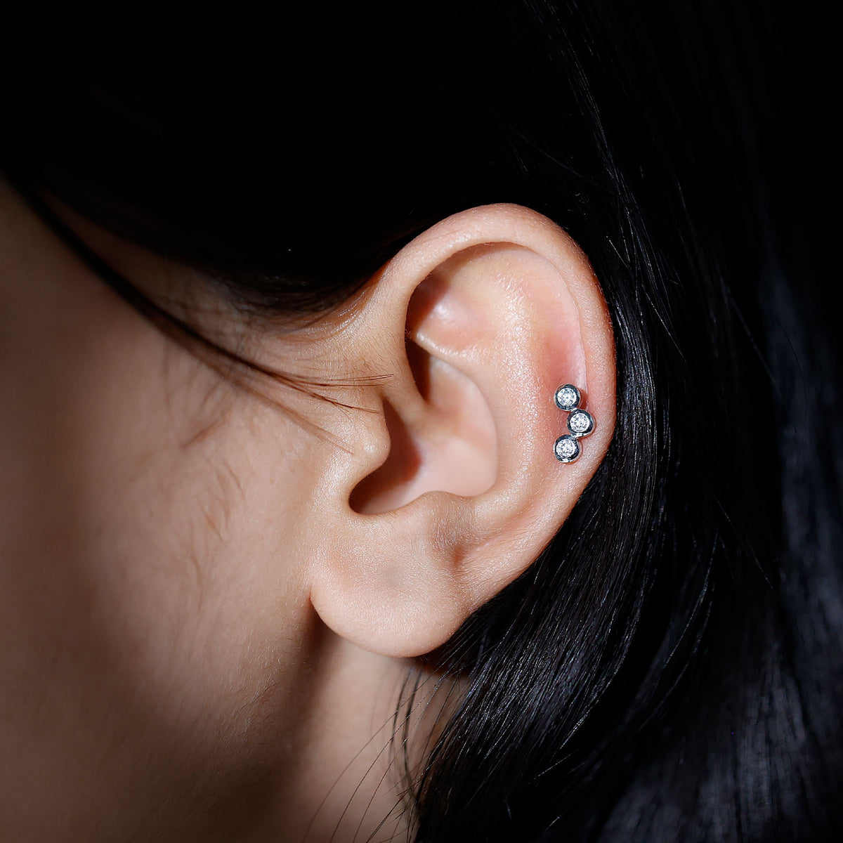 Three Diamond Curved Helix Earring in Bezel Setting