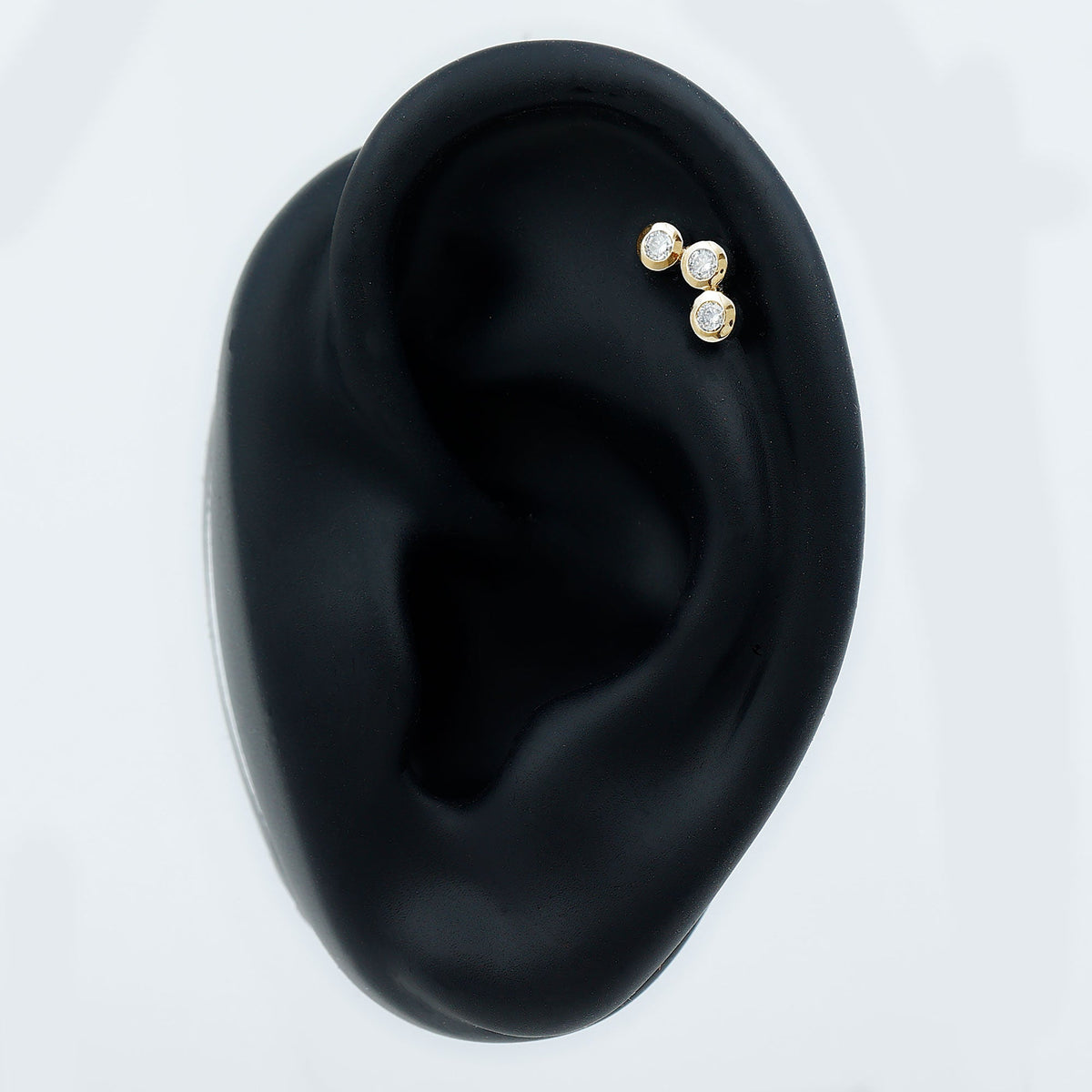 Three Diamond Curved Helix Earring in Bezel Setting