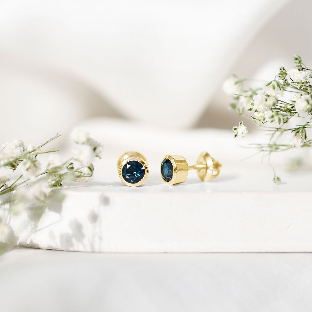 1.2 Carat Round Cut London Blue Topaz Solitaire Stud Earrings in Bezel Setting