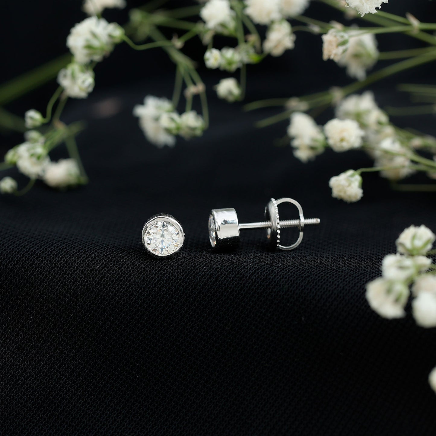 Certified 0.6 Carat Moissanite Stud Earrings in Bezel Setting