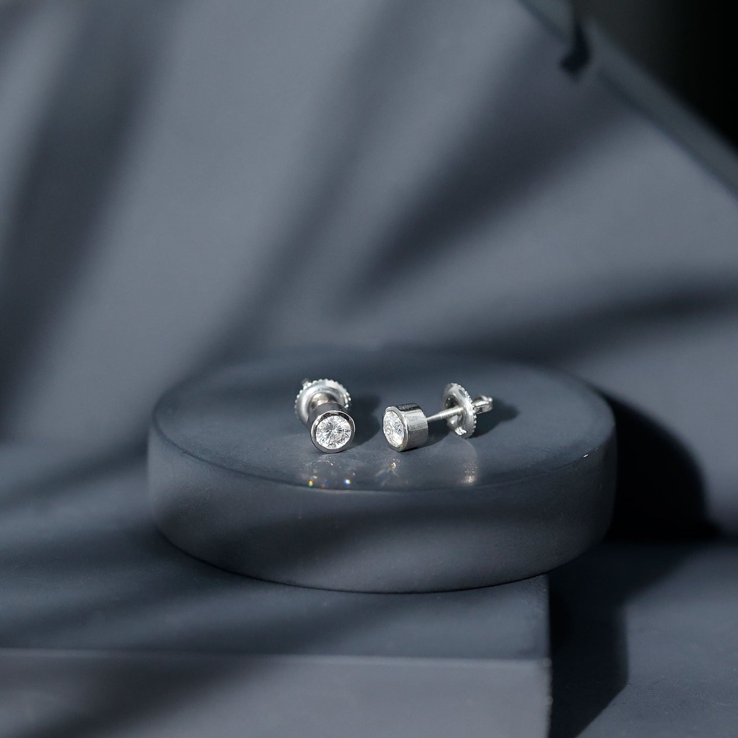 Certified 0.6 Carat Moissanite Stud Earrings in Bezel Setting