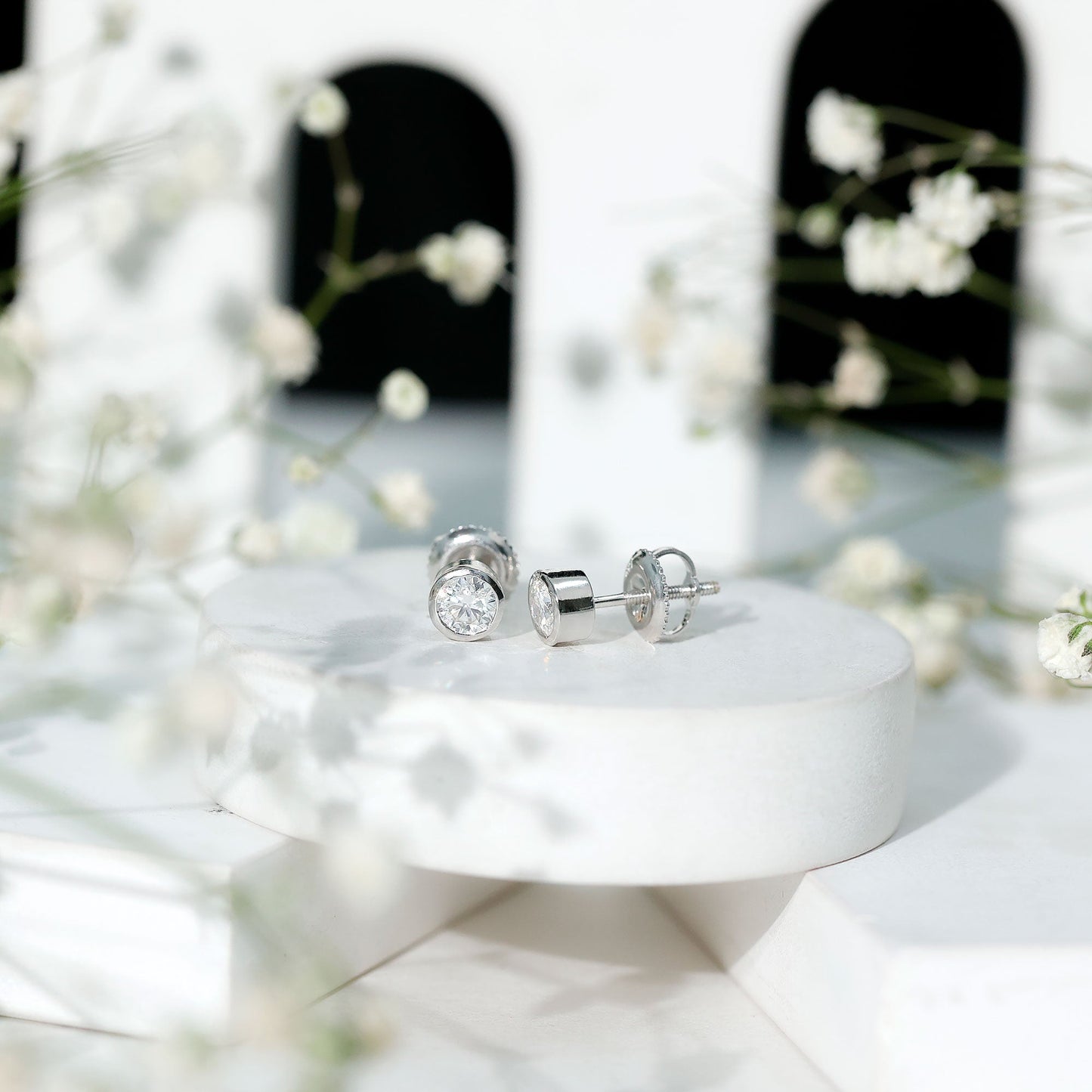 Certified 0.6 Carat Moissanite Stud Earrings in Bezel Setting