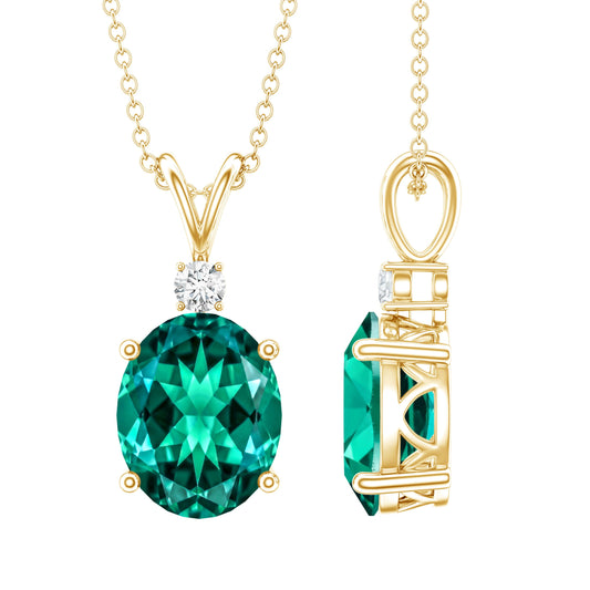 Oval Created Emerald and Moissanite Solitaire Pendant