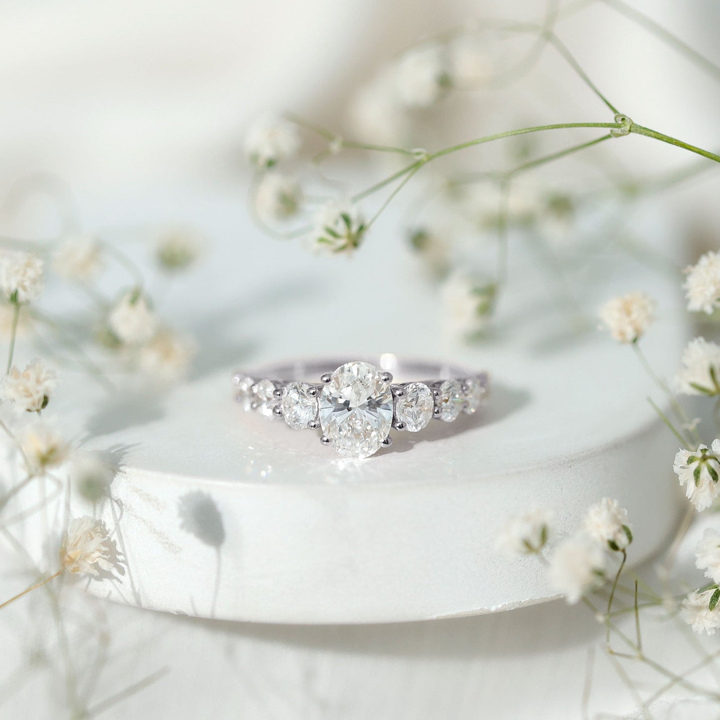 1.2 Carat Oval Cut Moissanite Side Stone Engagement Ring