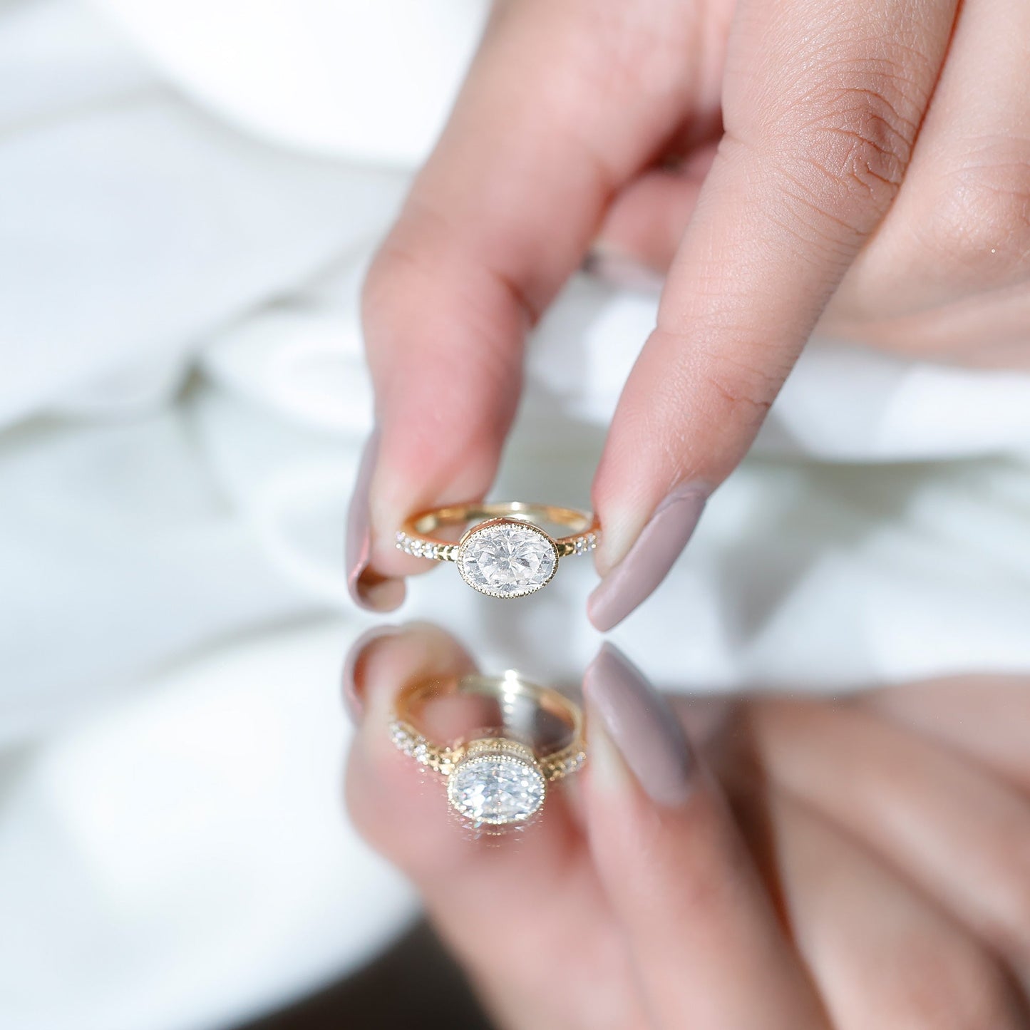 Moissanite East West Engagement Ring in Bezel Setting