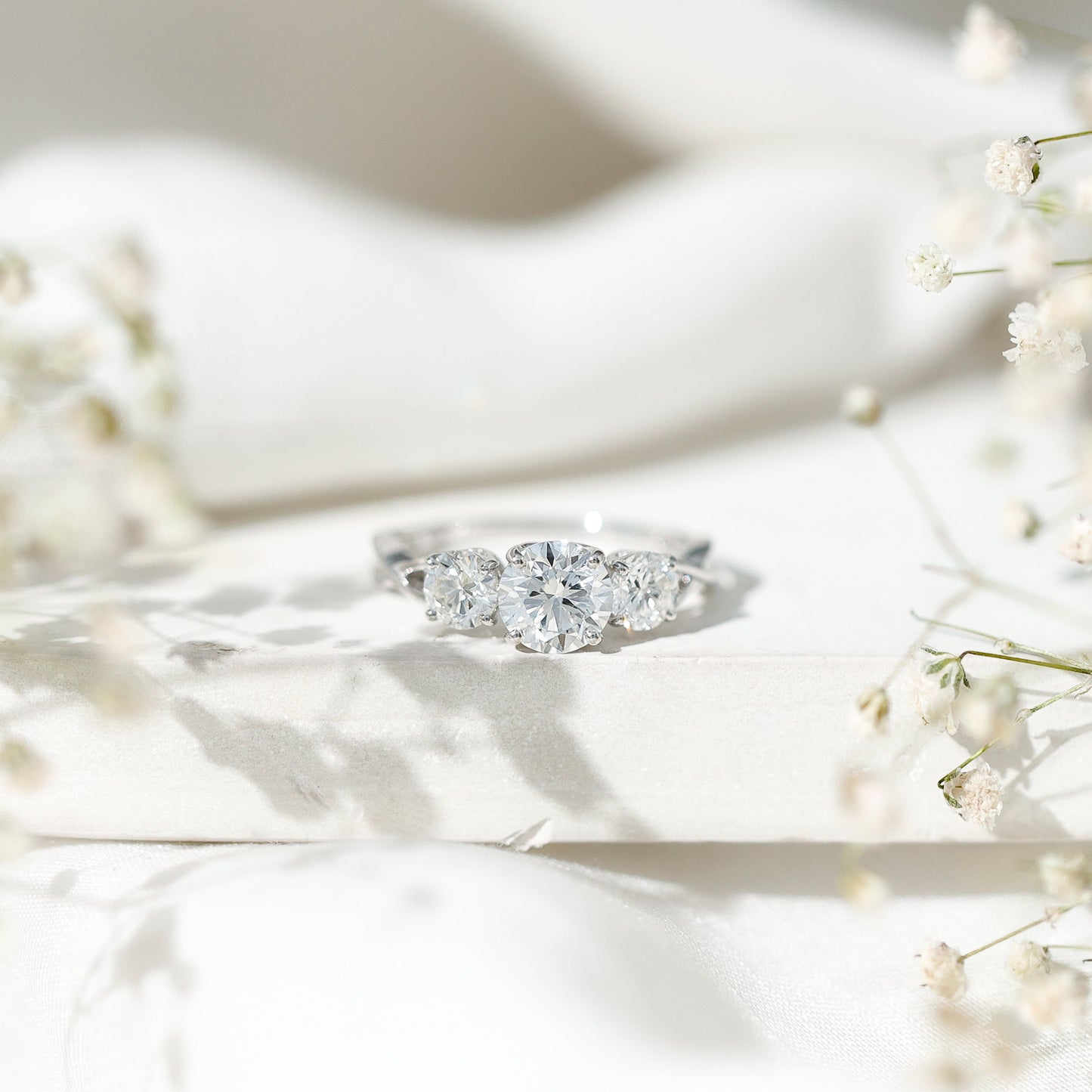 3 Stone Round Moissanite Crossover Engagement Ring