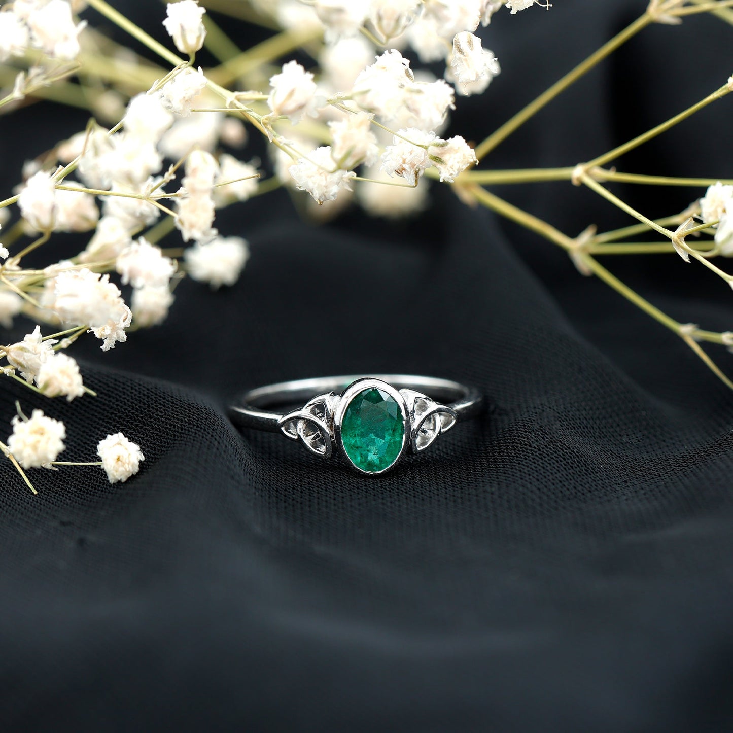 Oval Shaped Emerald Celtic Engagement Ring in Bezel Setting