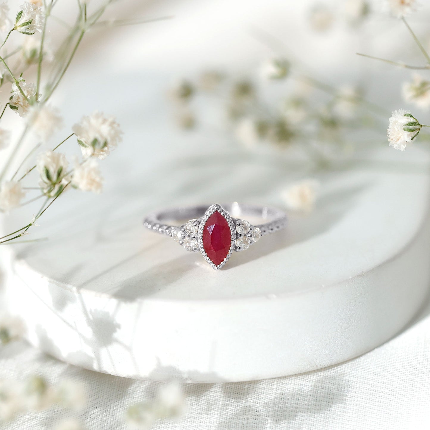 Vintage Style 0.75 Carat Ruby Marquise Engagement Ring with Diamond Trio