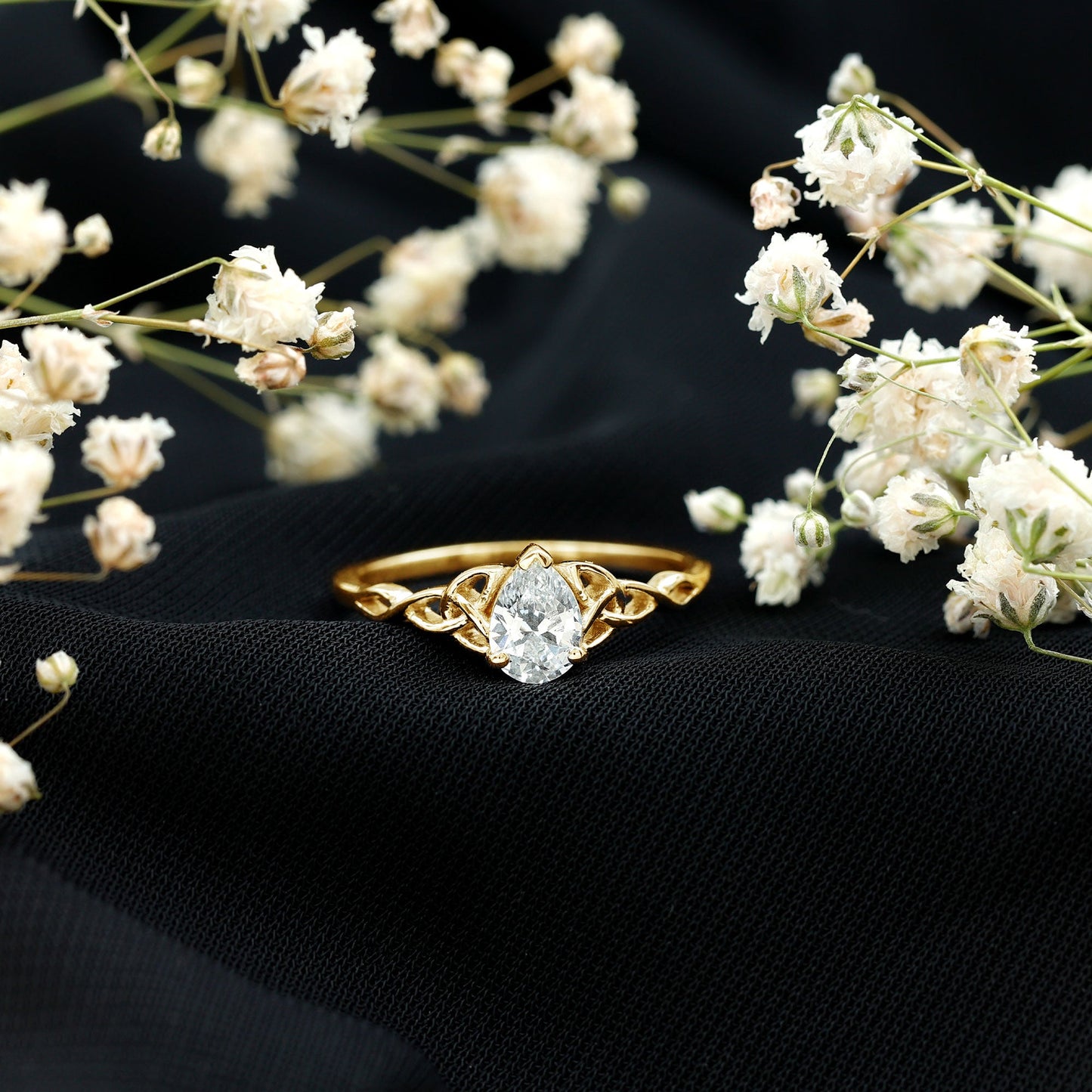 Pear Cut 0.79 Carat Moissanite Celtic Engagement Ring