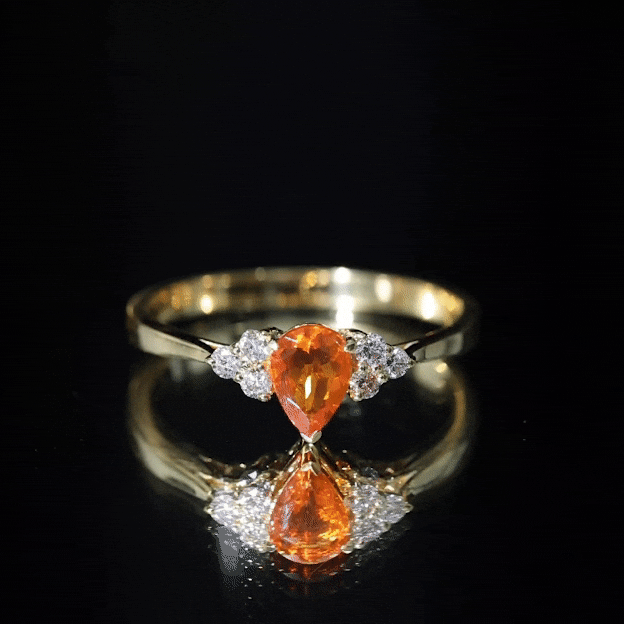 0.6 Carat Pear Shaped Fire Opal Engagement Ring with Diamond Trio