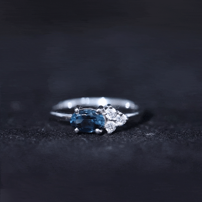 0.4 Carat Oval Cut London Blue Topaz East West Promise Ring with Diamond Trio