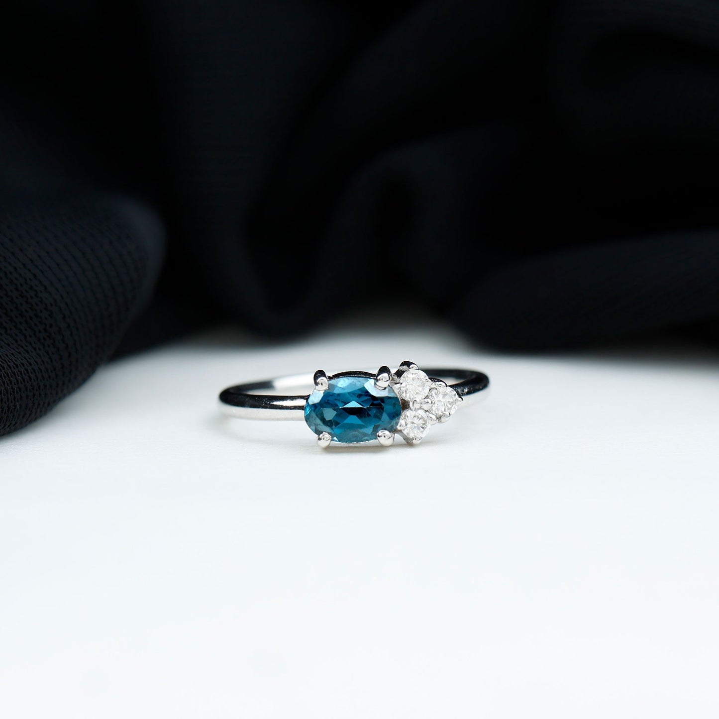 0.4 Carat Oval Cut London Blue Topaz East West Promise Ring with Diamond Trio