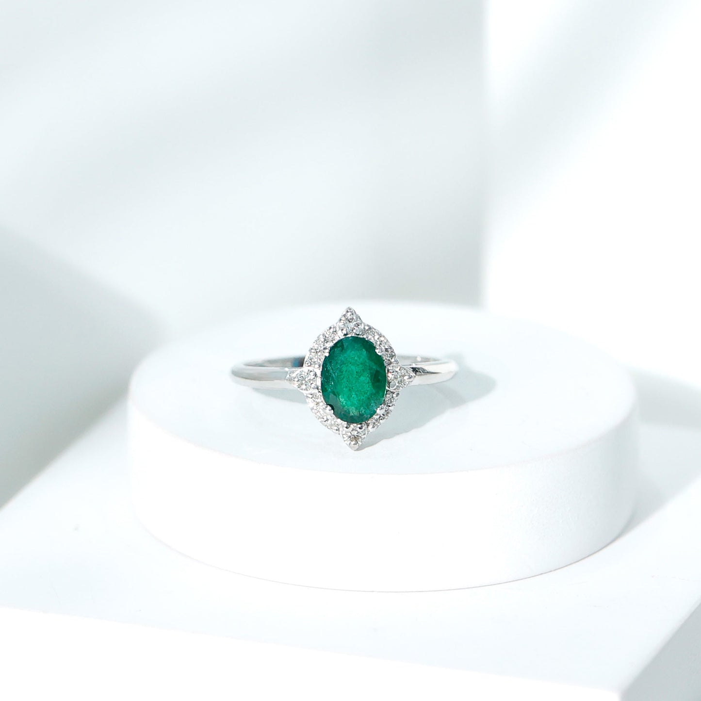 Vintage Looking Emerald Oval Engagement Ring with Diamond Halo