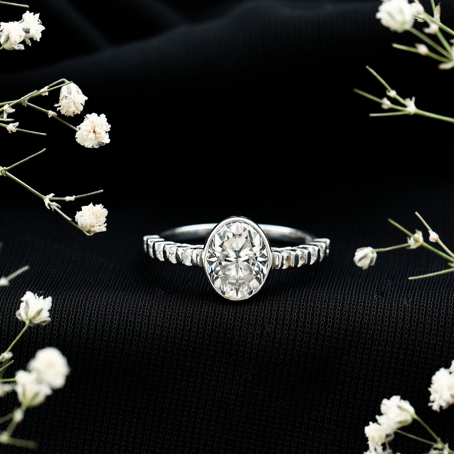 Bezel Set Moissanite Oval Engagement Ring with Side Stones