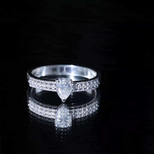 Pear Shaped Moissanite Solitaire Engagement Ring with Beaded Design