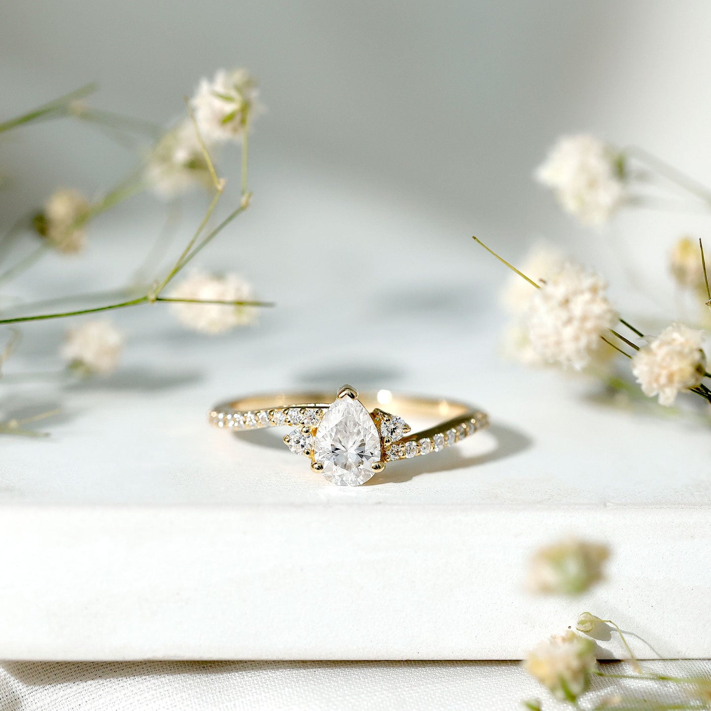 Pear Cut Moissanite Bypass Engagement Ring with Side Stones
